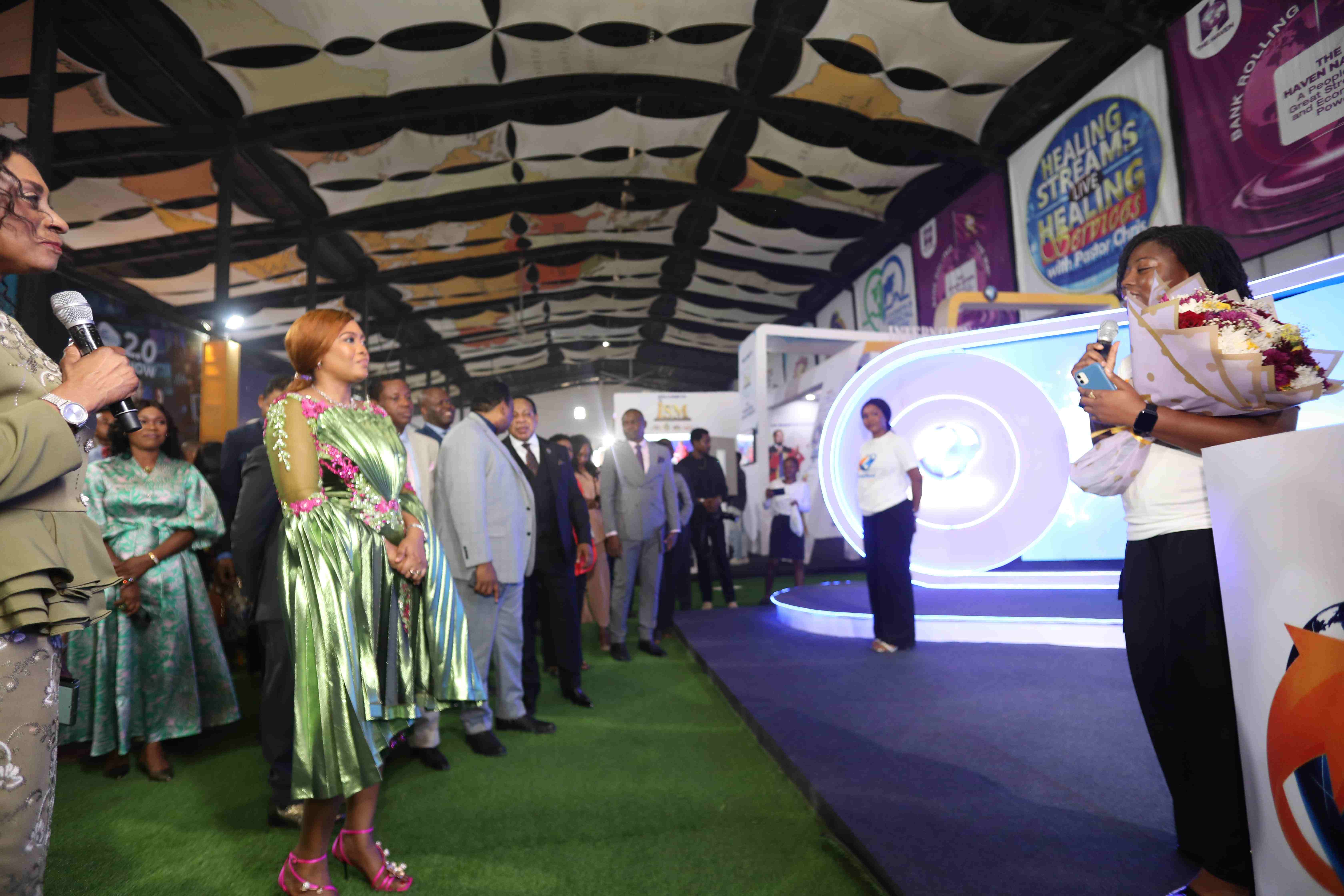 Delegates tour an illuminated installation